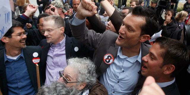 Aug. 4: Stuart Gaffney, from left, his husband John Lewis, Spencer Jones, and his husband Tyler Barrick celebrate after hearing the decision in the United States District Court proceedings challenging Proposition 8 outside of the Phillip Burton Federal Building in San Francisco.