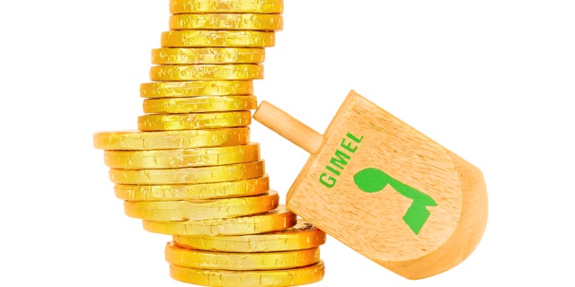 Dreidel is a traditional game for the Jewish holiday of Chanukah. Players spin, and win or lose depending on which hebrew letter appears on top. The Hebrew letter gimel wins the group of shiny wrapped chocolate coins.