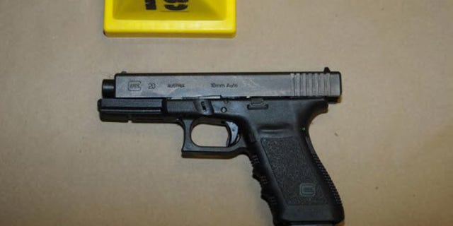NEWTOWN, CT - UNSPECIFED DATE: In this handout crime scene evidence photo provided by the Connecticut State Police, shows a Glock 20, 10mm found near the shooter in Room 10 at Sandy Hook Elementary School following the December 14, 2012 shooting rampage, taken on an unspecified date in Newtown, Connecticut . A report was released November 25, 2013 by Connecticut State Attorney Stephen Sedensky III summarizing the Newtown school shooting that left 20 children and six women dead inside Sandy Hook Elementary School. According to the report, a motive behind the shooting by gunman Adam Lanza is still unknown. (Photo by Connecticut State Police via Getty Images)
