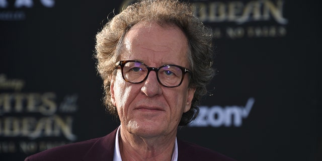 Geoffrey Rush is denying accusations of touching a woman inappropriately.