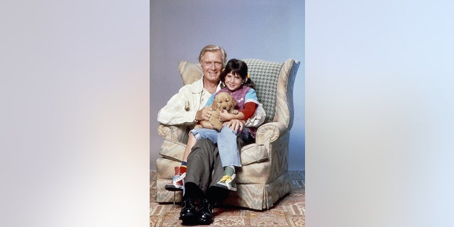 Pictured: (l-r) George Gaynes as Henry Warnimont, Soleil Moon Frye as Penelope 'Punky' Brewster, Brandon the Wonder Dog.