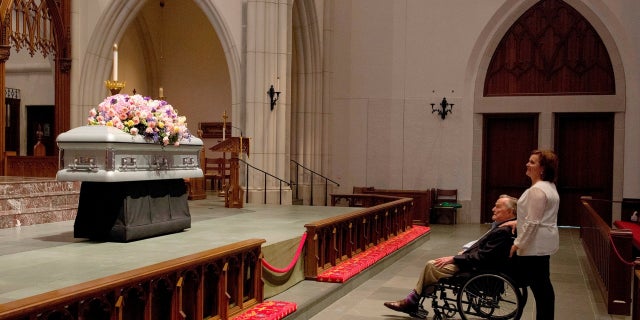 Former President George H.W. Bush was captured looking at his late wife's casket on Friday, April 20, 2018.