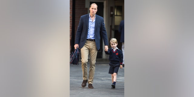 Britain's Prince William accompanies his son Prince George on his first day of school at Thomas's school in Battersea, London, September 7, 2017.