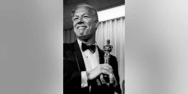 In this April 10, 1968, file photo, George Kennedy poses with his Oscar in Santa Monica, Calif, after winning best supporting actor for "Cool Hand Luke."