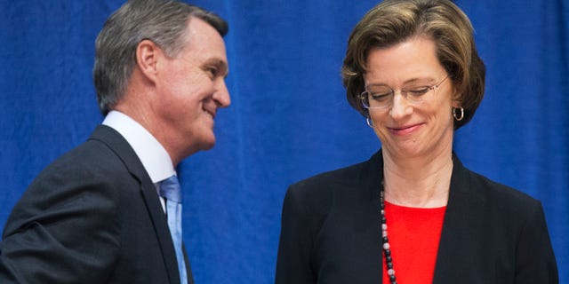 Oct. 7, 2014: Georgia Democratic candidate for U.S. Senate Michelle Nunn, right, passes Republican candidate David Perdue following a debate.