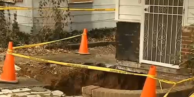 Feb. 5, 2014: A Georgia man rescued his wife after she fell into a sinkhole that opened up in front of their house.