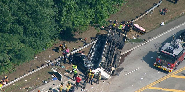 Officials respond to a crash involving a charter bus carrying a church group outside Atlanta.