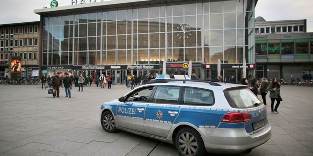 People walk past the central railway station in Cologne, Germany, Tuesday Jan. 5, 2016. City officials and police in Cologne are holding a crisis meeting following a series of sex assaults in the western German city on New Year's Eve
