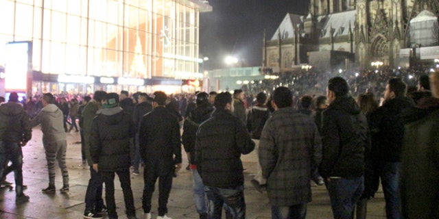 In this Dec. 31, 2015 picture, persons gather at the Cologne, Germany, main station