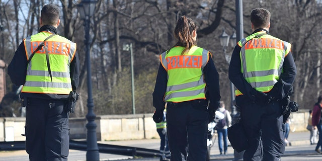 Police guard during the half marathon run in Berlin, Sunday, April 8, 2018.