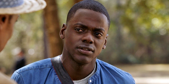This image released by Universal Pictures shows Daniel Kaluuya in a scene from, "Get Out." On Monday, Dec. 11, 2017, he was nominated for a Golden Globe for best actor in a motion picture comedy or musical for his role in the film.