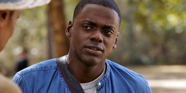 This image released by Universal Pictures shows Daniel Kaluuya in a scene from, "Get Out." On Monday, Dec. 11, 2017, he was nominated for a Golden Globe for best actor in a motion picture comedy or musical for his role in the film.