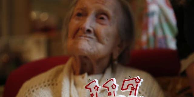 Emma Morano is pictured behind a cake with candles marking 117 years in Verbania, Italy, Tuesday, Nov. 29, 2016. At 117, Emma is the oldest person in the world and believed to be the last surviving person in the world born in the 1800s, coming into the world on Nov. 29, 1899.