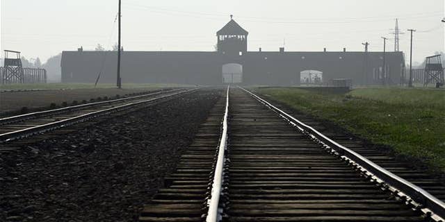 The entrance to the former Nazi German death camp of Birkenau in Oswiecim, Poland. (AP Photo/Alik Keplicz, File)