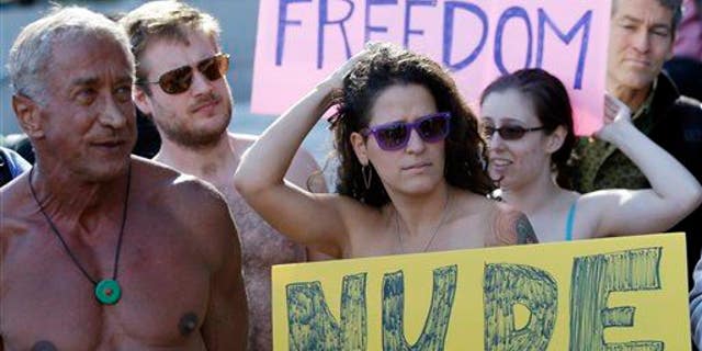 Demonstrators gather outside of City Hall in San Francisco for a protest against a proposed city-wide nudity ban, Wednesday, Nov. 14, 2012.