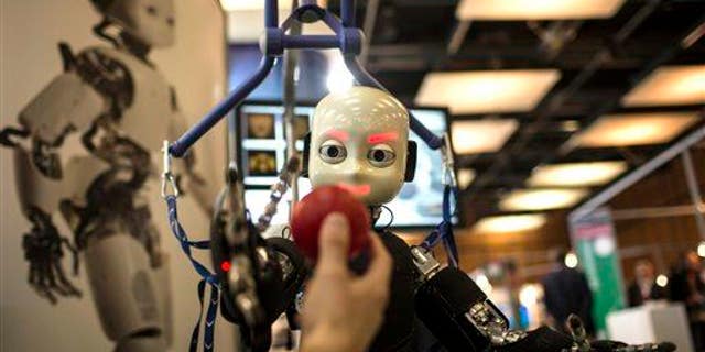File photo of a robot getting ready to catch a ball.