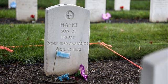 This Monday, Aug. 7, 2017 photo shows the headstone of Little Plume (aka Hayes Vanderbilt Friday), at Carlisle Barracks Cemetery in Carlisle, Pa.