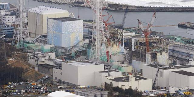 In this March 11, 2012, file photo, three melted reactors, from left, Unit 1, Unit 2 and Unit 3, are seen at Fukushima Dai-ichi nuclear power plant in Okuma, Fukushima prefecture, Japan.