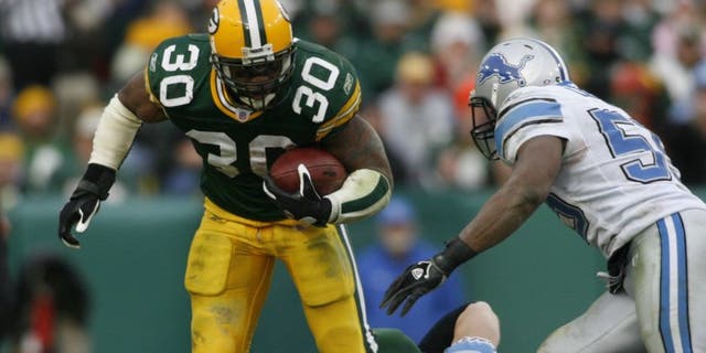 GREEN BAY, WI - DECEMBER 17: Ahman Green #30 of the Green Bay Packers runs through the tackle during a game against the Detroit Lions on December 17, 2006 at Lambeau Field in Green Bay, Wisconsin. (Photo by Sporting News via Getty Images)