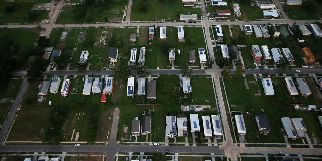 A 2015 photo shows new homes, many with solar panels constructed by the Make it Right Foundation, mixed with old homes and vacant lots in the Lower Ninth Ward in New Orleans, Louisiana.