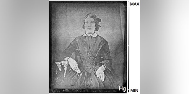 An image of a woman is recovered from a 19th-century daguerreotype that had tarnished almost beyond recognition. With the novel process, researchers mapped its mercury content and brought the 'ghost' back to life. (Credit: National Gallery of Canada/Western University)