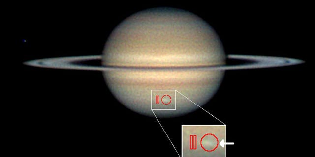 Amateur astronomer Christopher Go took this image of the storm on March 13, 2010. The arrow indicates the location of the storm and the red outlines show where Cassini's composite infrared spectrometer gathered data.