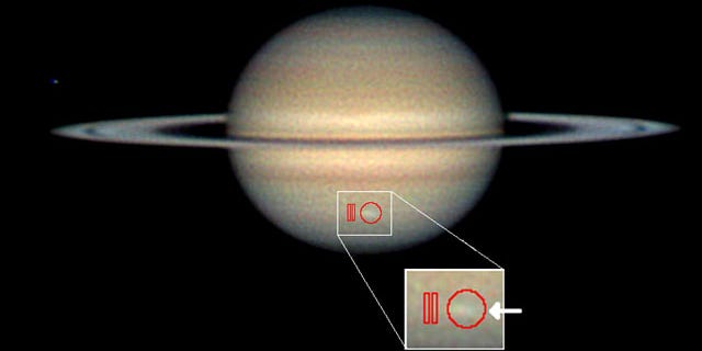 Amateur astronomer Christopher Go took this image of the storm on March 13, 2010. The arrow indicates the location of the storm and the red outlines show where Cassini's composite infrared spectrometer gathered data.