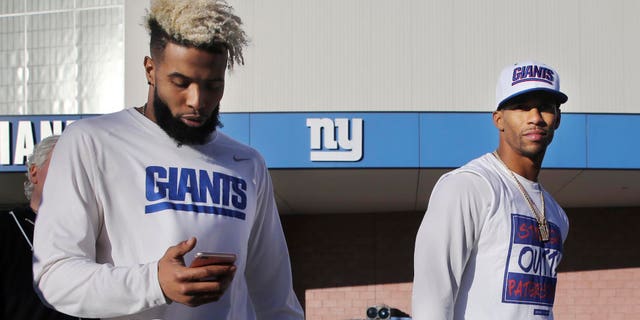 New York Giants wide receivers Odell Beckham, center, and Victor Cruz, right, walk together after practice on Wednesday.