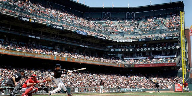 May 2, 2015: San Francisco Giants' Buster Posey hits a double against the Los Angeles Angels in San Francisco.