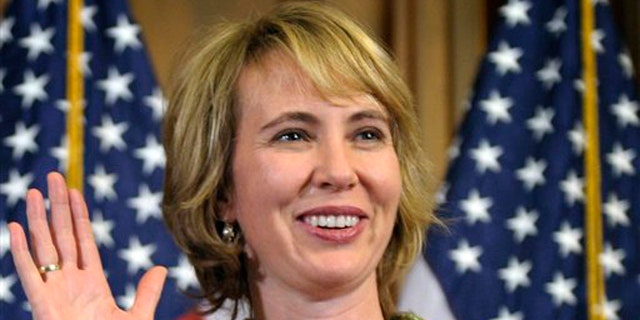 In this Jan. 5 file photo, Rep. Gabrielle Giffords takes part in a reenactment of her swearing-in on Capitol Hill.