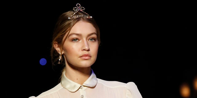 February 15, 2016. Model Gigi Hadid presents a creation from the Tommy Hilfiger Fall/Winter 2016 collection during New York Fashion Week.