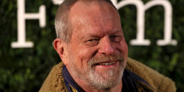 U.S. director Terry Gilliam poses for photographers at the Evening Standard British Film Awards in London, Britain February 7, 2016.