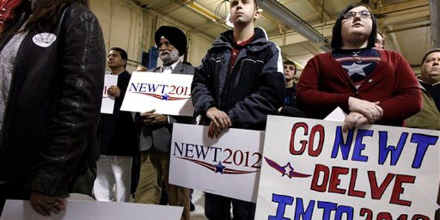 Jan. 2, 2012: Supporters watch as Newt Gingrich speaks at his campaign headquarters in Davenport, Iowa.