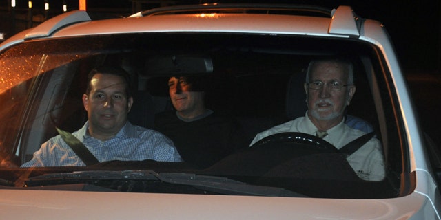 Nov. 29: Gary Giordano, center, pictured shortly after being freed from police custody, sitting in the back of an SUV driven away from an Aruban detention facility by local lawyer Chris Lejuez, and American lawyer Jose Baez, left, in Oranjestad, Aruba.