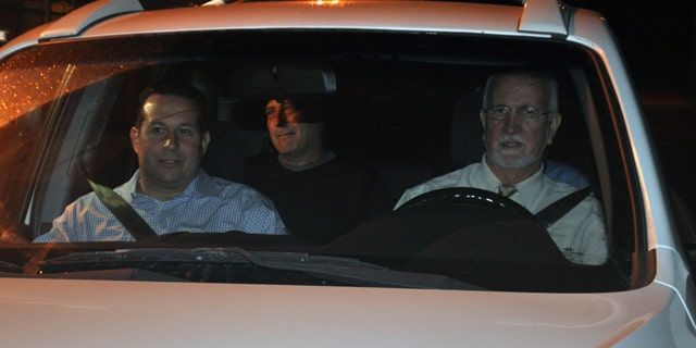 Nov. 29: Gary Giordano, center, pictured shortly after being freed from police custody, sitting in the back of an SUV driven away from an Aruban detention facility by local lawyer Chris Lejuez, and American lawyer Jose Baez, left, in Oranjestad, Aruba.