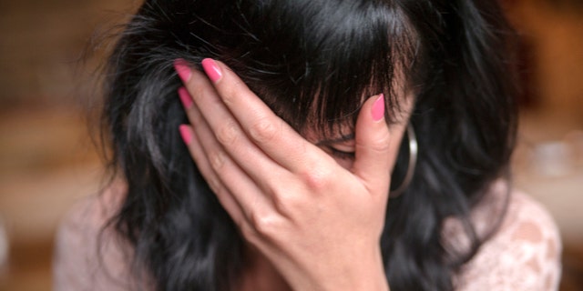 Young shy woman hiding your face-girl covering her face