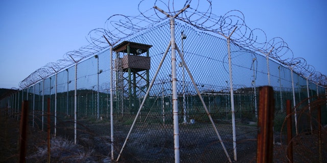 FILE PHOTO - Chain link fence and concertina wire surrounds a deserted guard tower within Joint Task Force Guantanamo's Camp Delta at the U.S. Naval Base in Guantanamo Bay, Cuba March 21, 2016. REUTERS/Lucas Jackson/File Photo