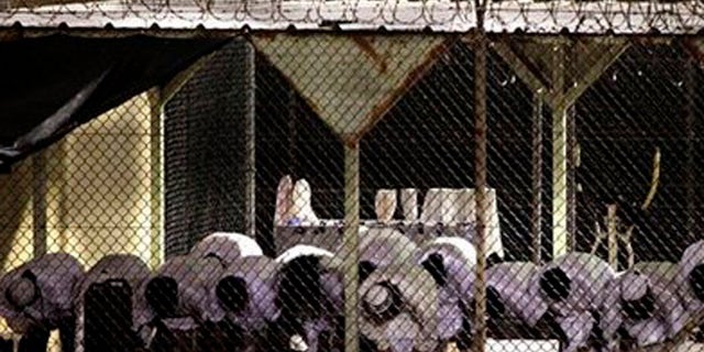 Terrorists held at Guantanamo Bay could soon be transferred to U.S. prisons, where critics say they could influence other inmates.