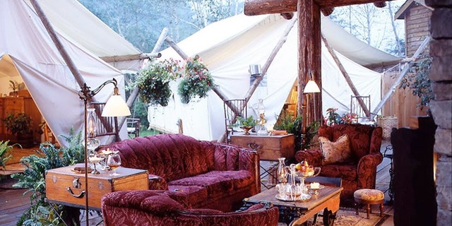 The tent lounge area at Clayouquot Resort in Vancouver Island, Canada has comfy couches and amenities you'd find at home.