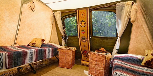 Guests pay roughly $750 a night to bed down in a spacious canvas tent, complete with cushy cots, blankets, rugs and even cowhide pillows.