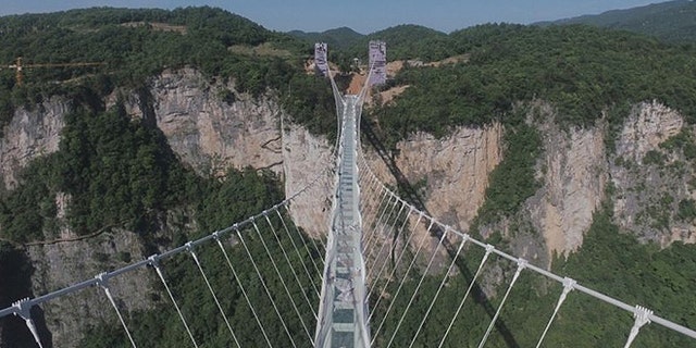 World's longest 'glass bridge' closed down after large influx of ...