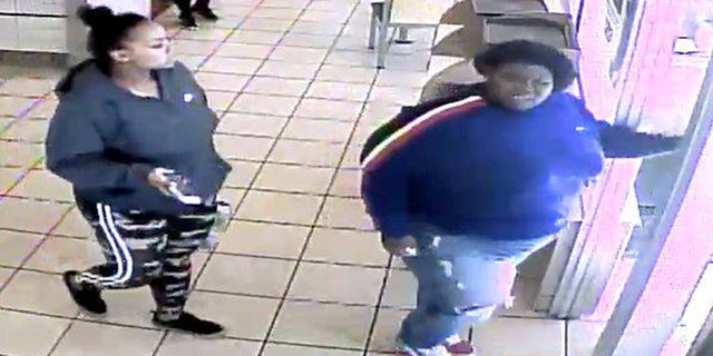Security footage captured the suspect, in blue, shoving the female employee into a fry station, causing her to hit her head.
