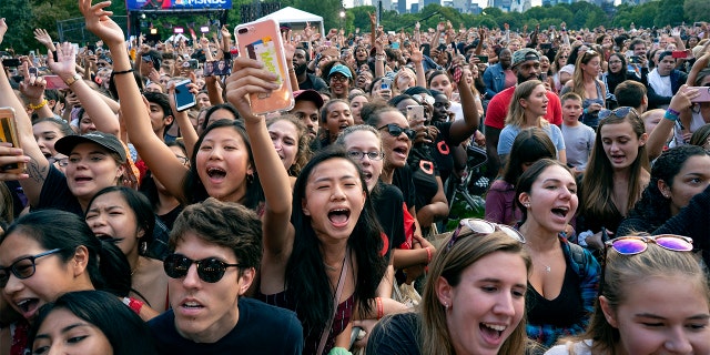 Festival goers watch a performance during the 2018 Global Citizen Festival Saturday, Sept. 29, 2018, in New York. (AP Photo/Craig Ruttle)