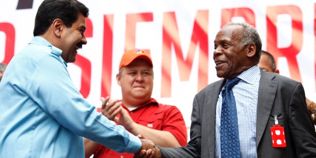 Actor Danny Glover with Venezuelan President Nicolas Maduro at a 2014 memorial service for the late Venezuelan leader, Hugo Chavez