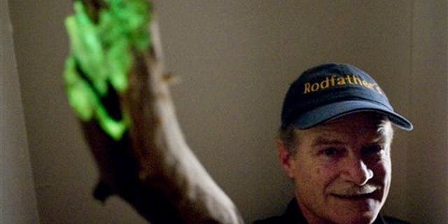 April 6: Samuel Holes, 52, displays his glowing stick in a dark closet during a four second exposure at the Juno House in Juneau, Alaska. Holes found the stick while searching for firewood on a recent camping trip near the base of Thunder Mountain. (AP)