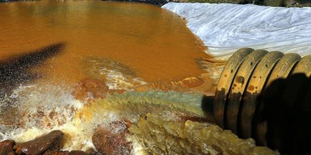Aug. 14, 2015: Water flows through a series of retention ponds from the Gold King mine chemical spill.