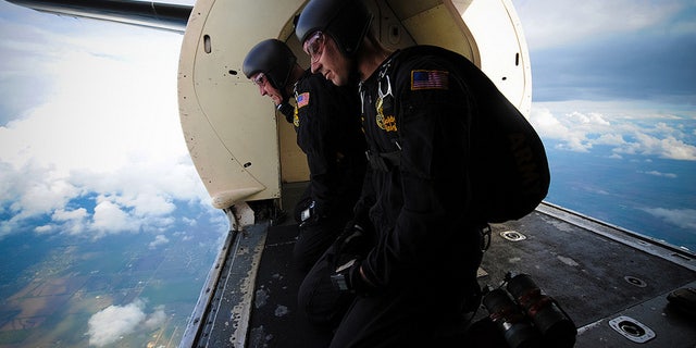Golden knight parachutists ready to jump