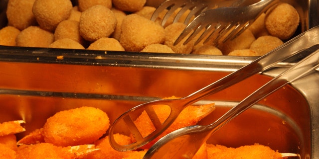 fried crab claws and stuffed olives in a restaurant take away