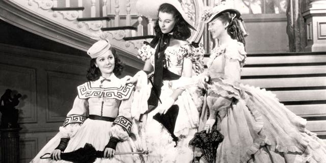 This undated image from the film "Gone with the Wind" provided by New Line Cinema shows, from left, Ann Rutherford, Vivien Leigh and Evelyn Keyes.
