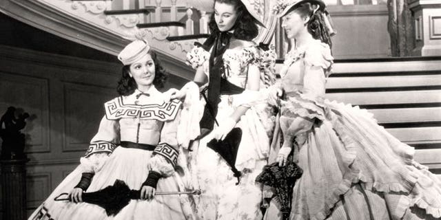 This undated image from the film "Gone with the Wind" provided by New Line Cinema shows, from left, Ann Rutherford, Vivien Leigh and Evelyn Keyes.